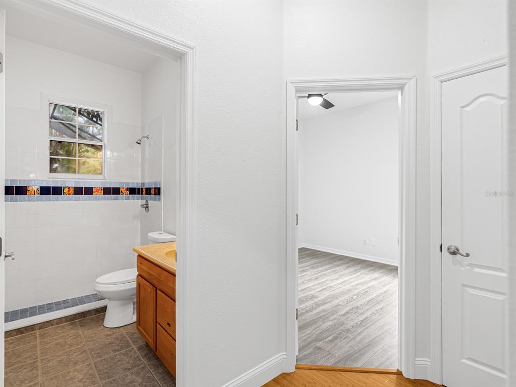 1670 Taylor Ridge Loop Kissimmee, FL 34744 - Photo 25 of 36 a bathroom with a toilet