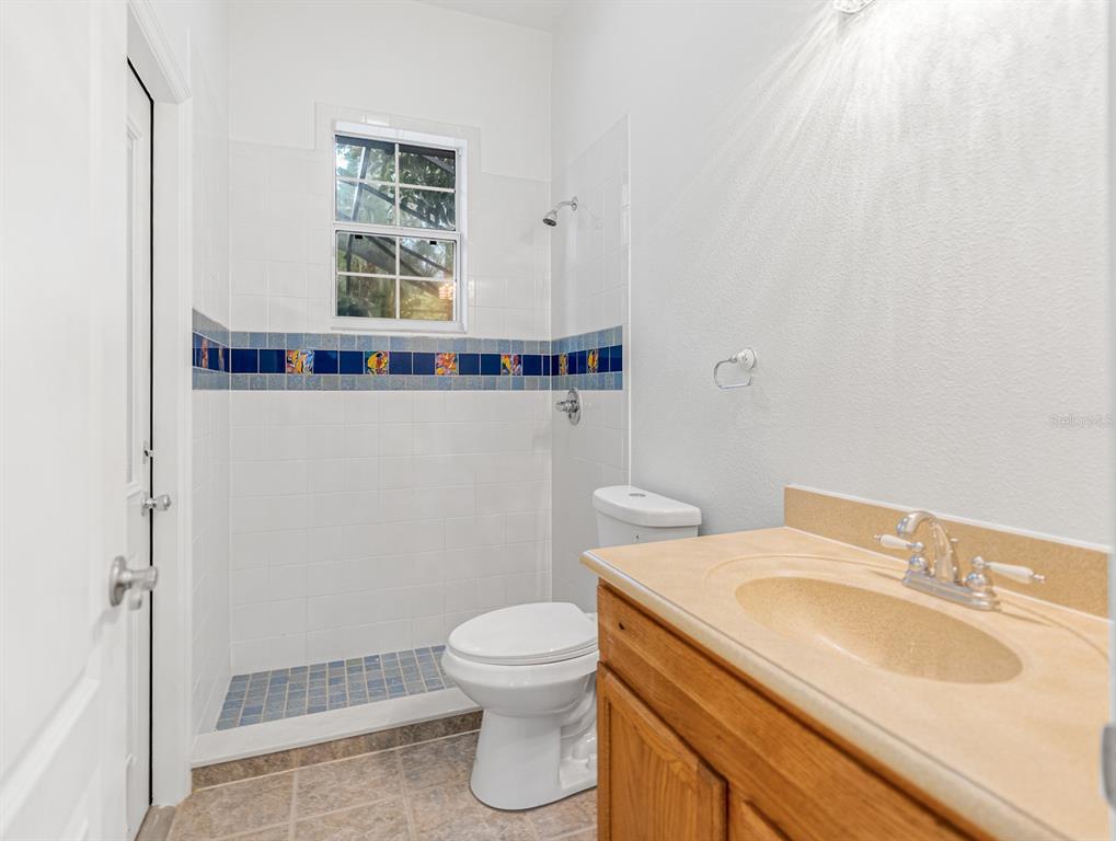 1670 Taylor Ridge Loop Kissimmee, FL 34744 - Photo 26 of 36 a bathroom with a sink toilet and shower