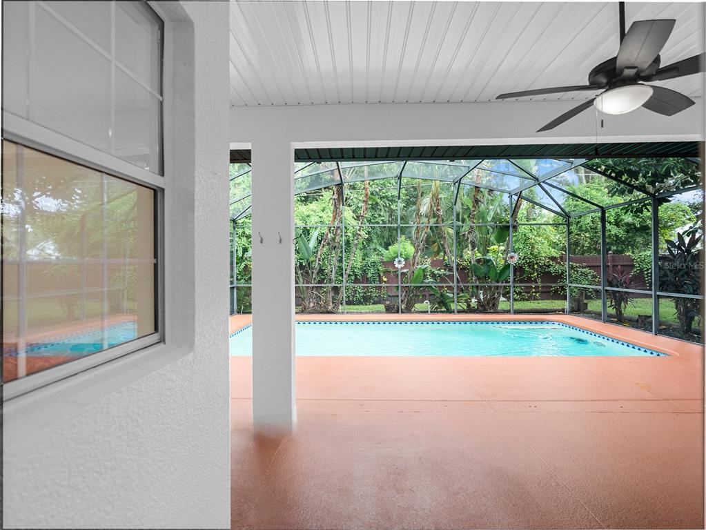 1670 Taylor Ridge Loop Kissimmee, FL 34744 - Photo 27 of 36 a view of empty room with floor to ceiling windows