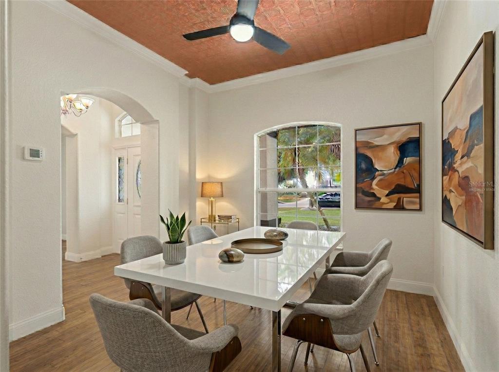 1670 Taylor Ridge Loop Kissimmee, FL 34744 - Photo 6 of 36 a view of a dining room with furniture window and wooden floor