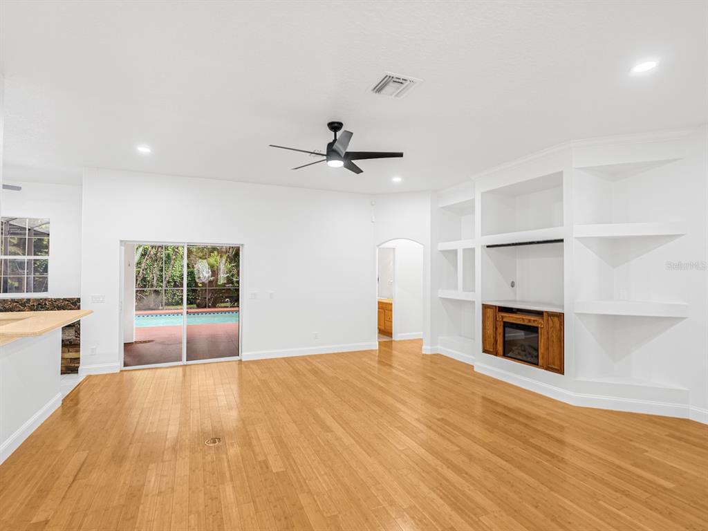 1670 Taylor Ridge Loop Kissimmee, FL 34744 - Photo 8 of 36 a bedroom with a bed and a fireplace