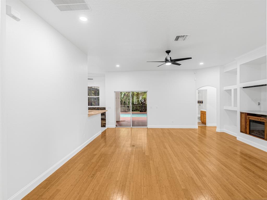 1670 Taylor Ridge Loop Kissimmee, FL 34744 - Photo 9 of 36 a view of a livingroom with a ceiling fan and window