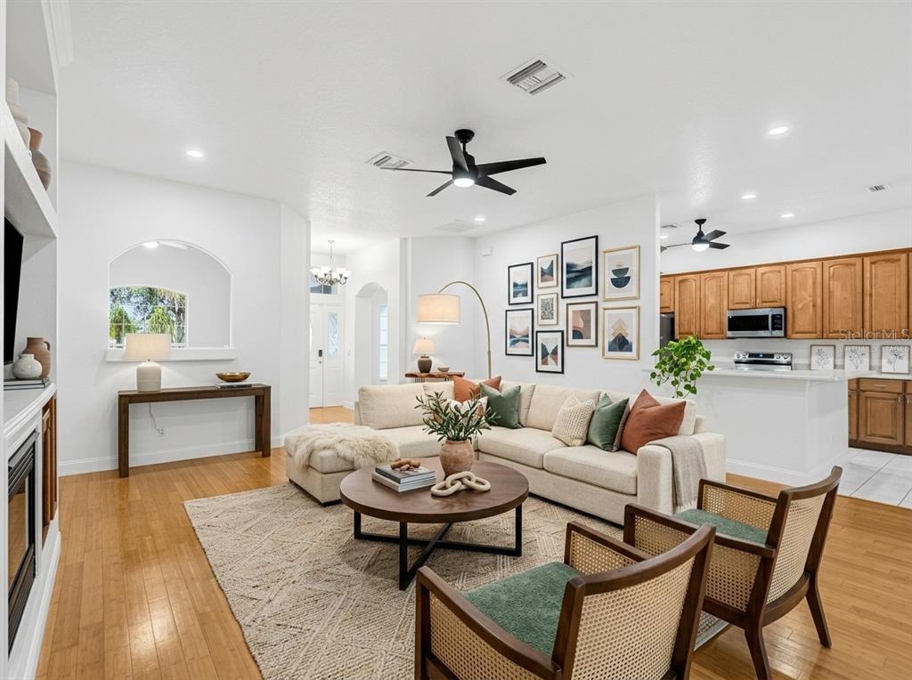 1670 Taylor Ridge Loop Kissimmee, FL 34744 - Photo 10 of 36 a living room with fireplace furniture and a wooden floor