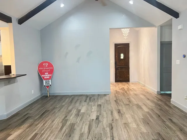 a bedroom with a bed couch and a window