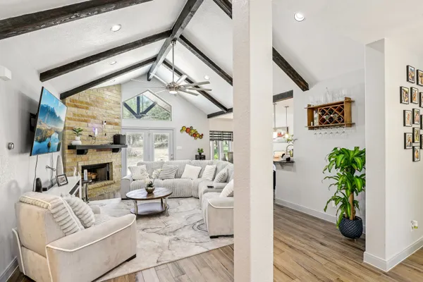 a large kitchen with stainless steel appliances granite countertop a large stove a sink and a refrigerator