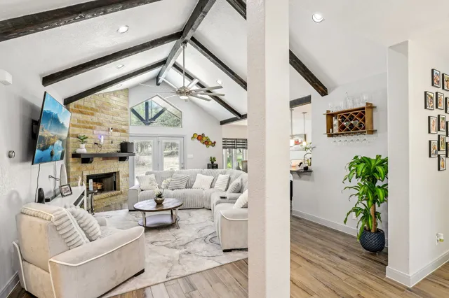 a living room with furniture and a fireplace