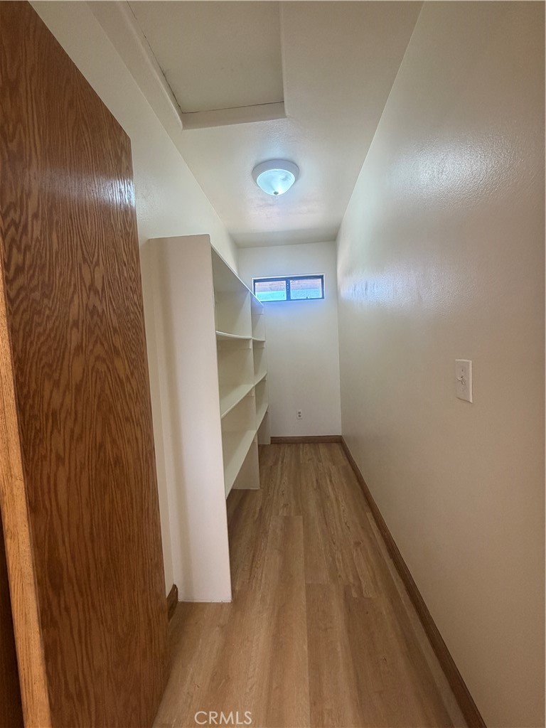 19609 Seneca Road Apple Valley, CA 92307 - Photo 17 of 37 a view of empty room with wooden floor