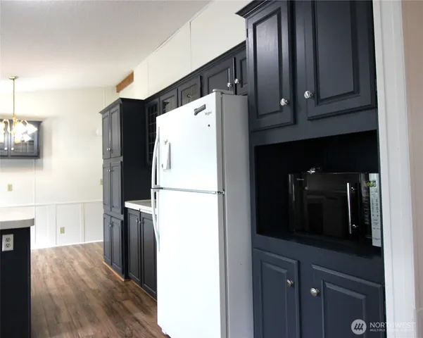 a white refrigerator freezer sitting in a kitchen