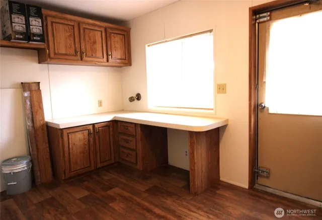 a kitchen with a sink and a window