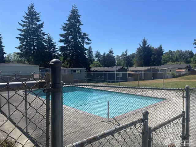 a view of a swimming pool with a patio