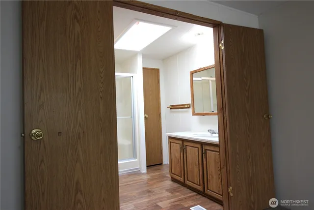 a bathroom with a sink and mirror