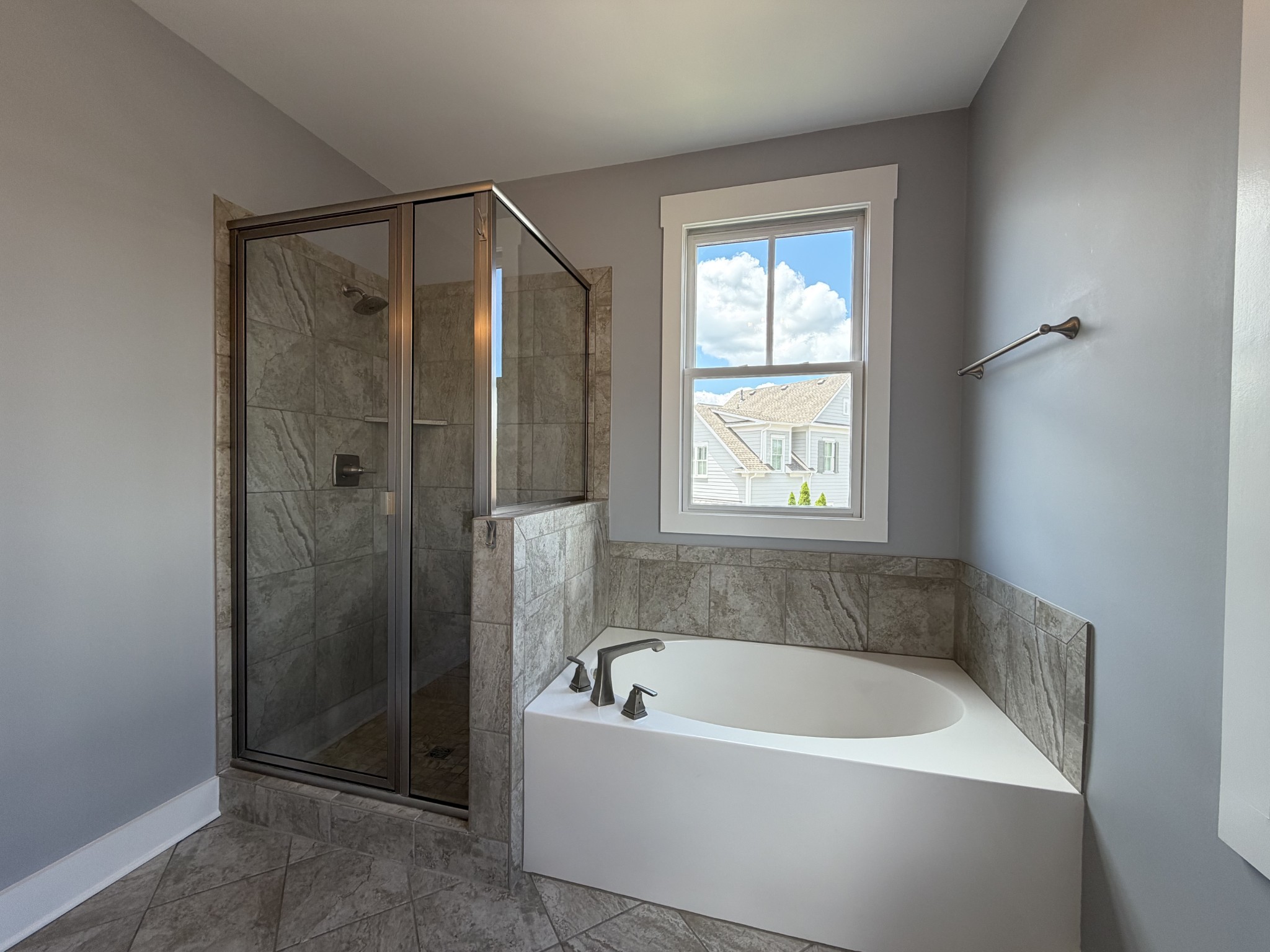 3097 Rural Plains Circle Franklin, TN 37064 - Photo 16 of 28 a bathroom with a bathtub and shower