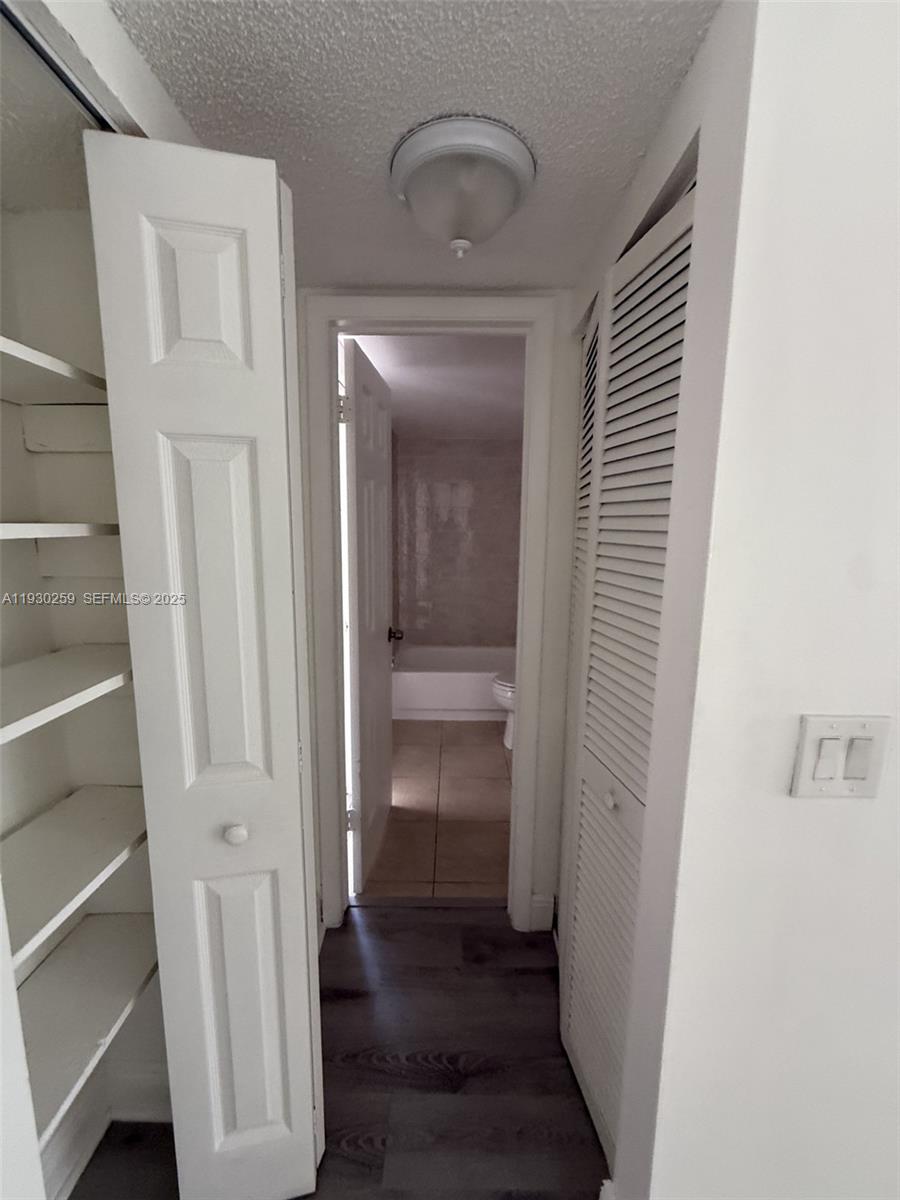 19729 Southwest 114th Avenue, Unit 251 Miami, FL 33157 - Photo 6 of 10 a view of an empty walk in closet