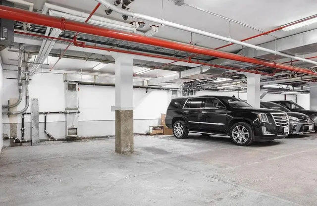 a large room with a large window and furniture