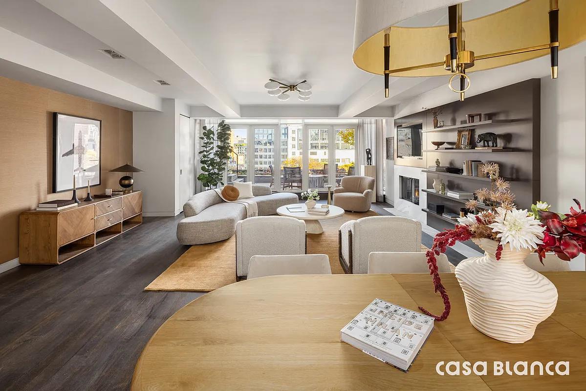 60 Collister Street, Unit PH5B Manhattan, NY 10013 - Photo 13 of 23 a living room with furniture and a large window