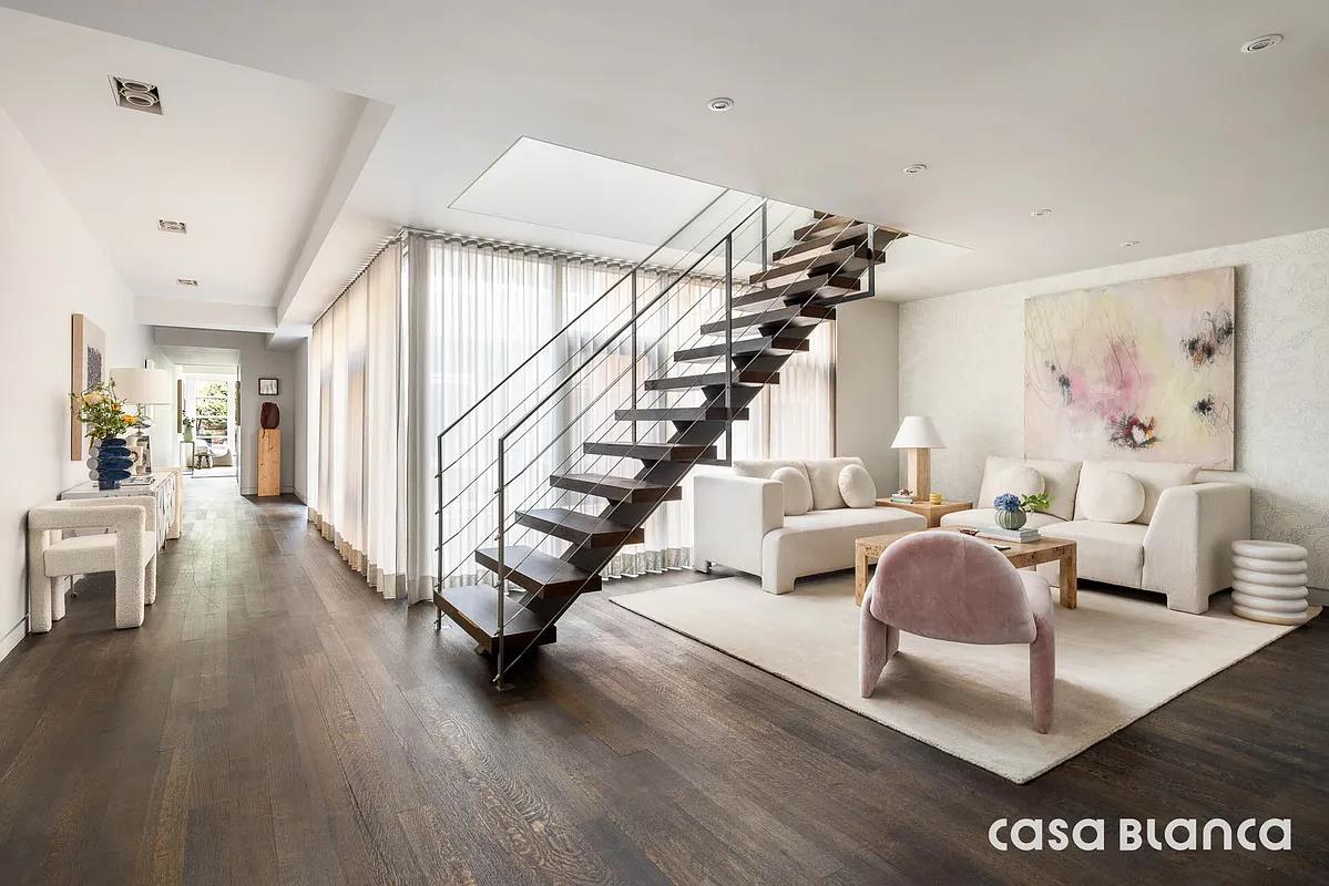 60 Collister Street, Unit PH5B Manhattan, NY 10013 - Photo 16 of 23 a living room with furniture and wooden floor