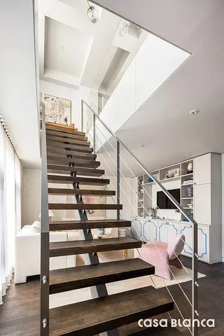 a living room with fireplace furniture and a floor to ceiling window