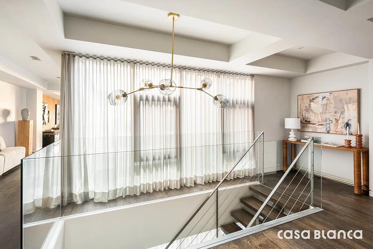 60 Collister Street, Unit PH5B Manhattan, NY 10013 - Photo 21 of 23 a view of a living room and a floor to ceiling window