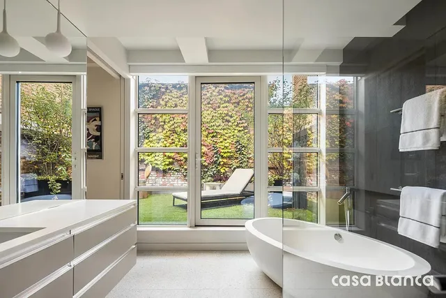 a view of a living room and a floor to ceiling window