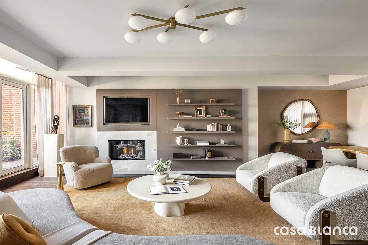 60 Collister Street, Unit PH5B Manhattan, NY 10013 - Photo 2 of 23 a living room with furniture and a fireplace