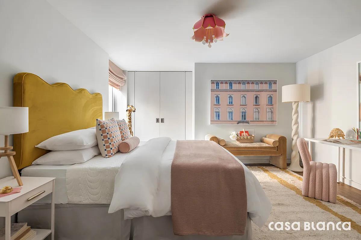 60 Collister Street, Unit PH5B Manhattan, NY 10013 - Photo 4 of 23 a bedroom with a bed and a couch