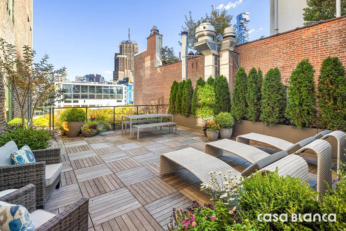 60 Collister Street, Unit PH5B Manhattan, NY 10013 - Photo 5 of 23 a view of a patio with couches table and chairs and potted plants