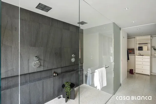 a living room with furniture a window and a dining table