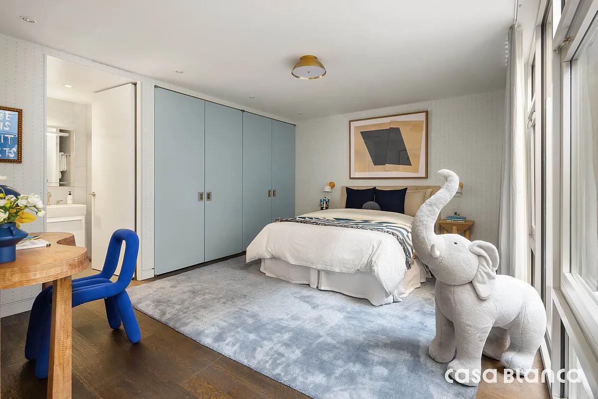 60 Collister Street, Unit PH5B Manhattan, NY 10013 - Photo 9 of 23 a bedroom with a bed and workspace