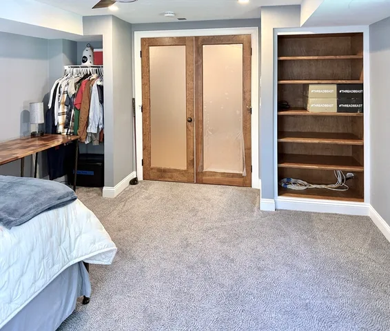 a view of a livingroom with furniture and closet