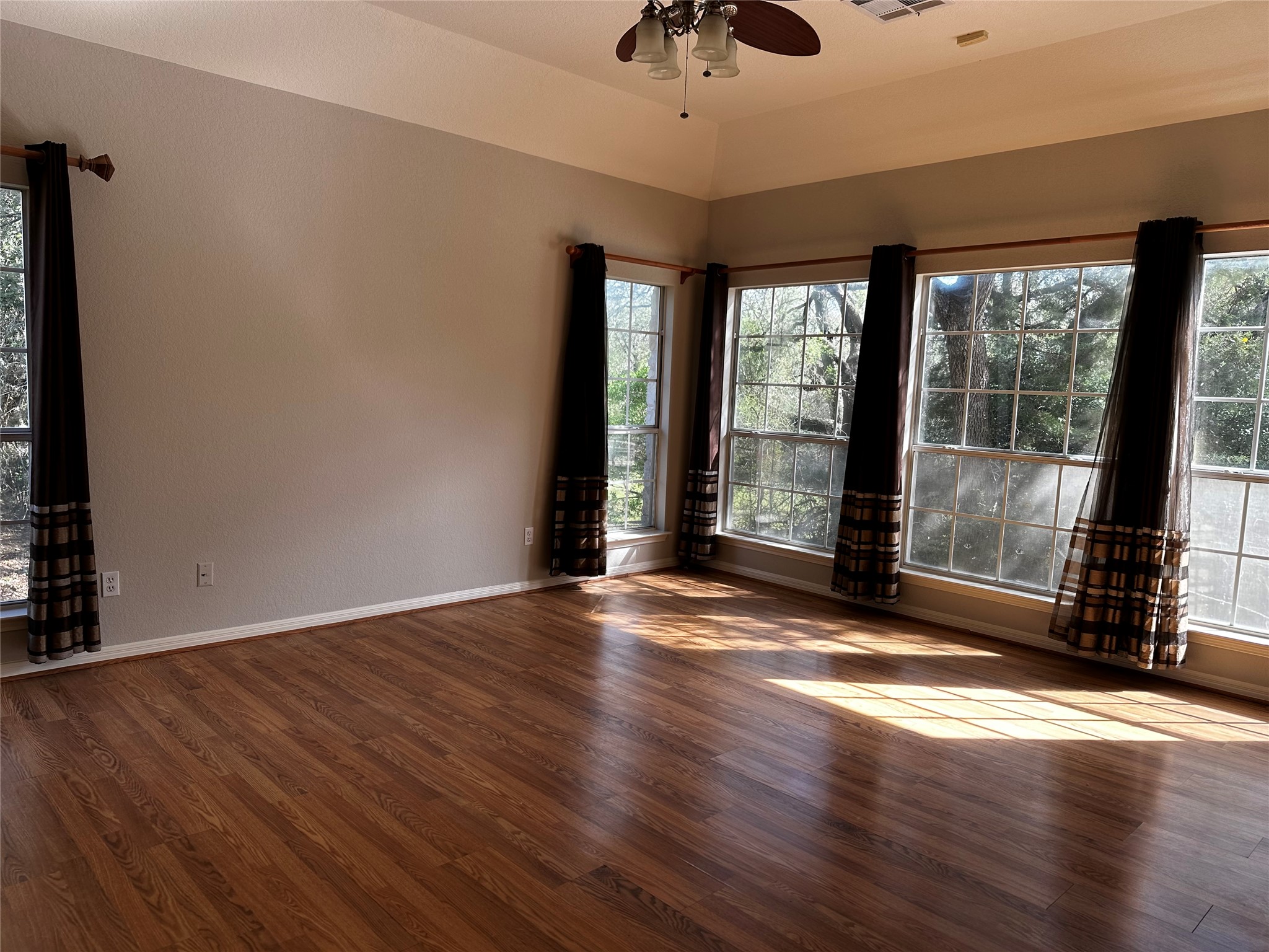 13615 Copperleaf Trail Manchaca, TX 78652 - Photo 21 of 39 Unfurnished room featuring dark wood-style floors and a ceiling fan