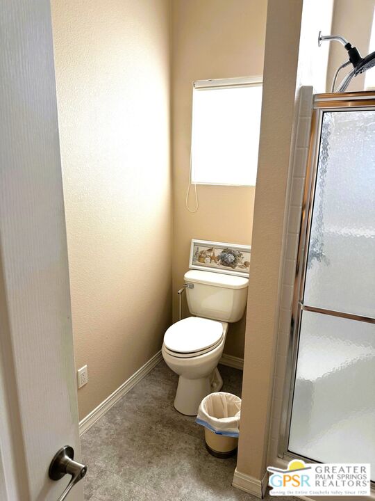 17640 Corkill Road, Unit 37 Desert Hot Springs, CA 92241 - Photo 18 of 35 a white toilet sitting next to a small sink