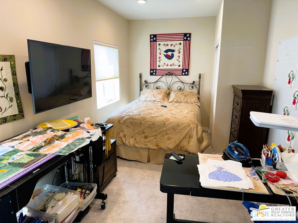 17640 Corkill Road, Unit 37 Desert Hot Springs, CA 92241 - Photo 19 of 35 a bedroom with a bed and a flat screen tv