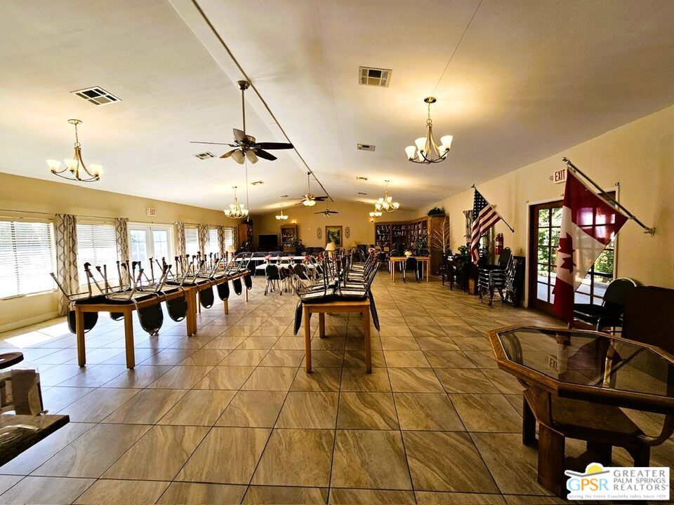 17640 Corkill Road, Unit 37 Desert Hot Springs, CA 92241 - Photo 29 of 35 a gym room with lots of furniture and painting on the wall