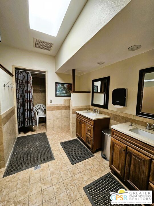 17640 Corkill Road, Unit 37 Desert Hot Springs, CA 92241 - Photo 32 of 35 a kitchen with granite countertop a stove and a refrigerator