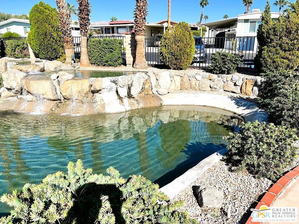 17640 Corkill Road, Unit 37 Desert Hot Springs, CA 92241 - Photo 35 of 35 a view of a swimming pool with a yard