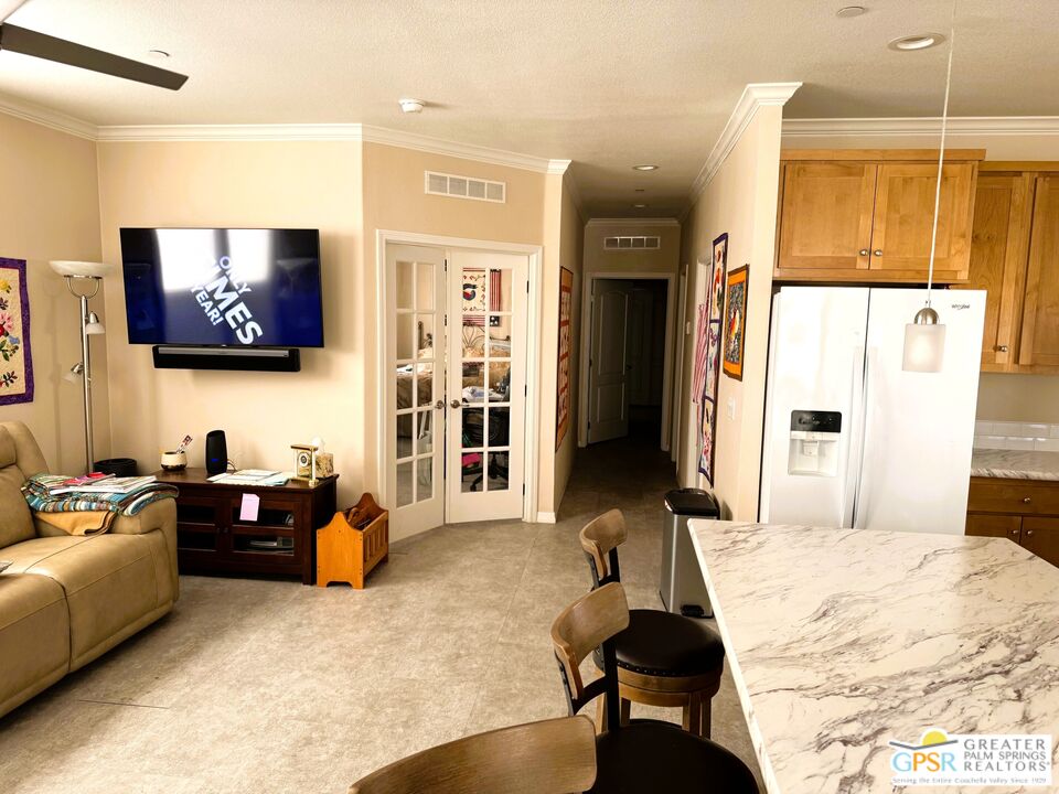 17640 Corkill Road, Unit 37 Desert Hot Springs, CA 92241 - Photo 9 of 35 a living room with furniture and a flat screen tv