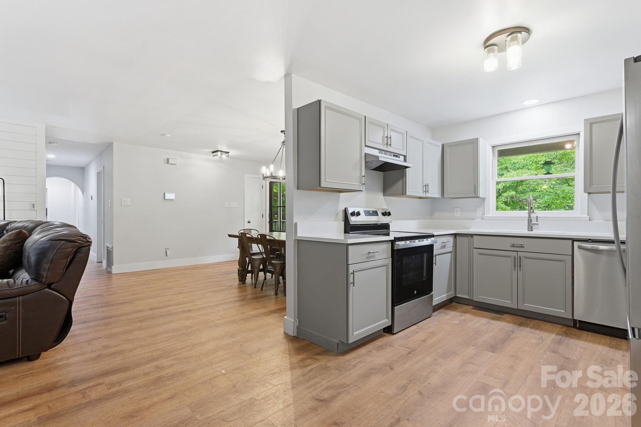 5347 Haney Road York, SC 29745 - Photo 6 of 39 a kitchen with a refrigerator and a stove top oven