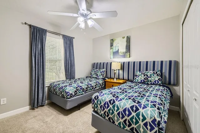 a bedroom with bed and a window