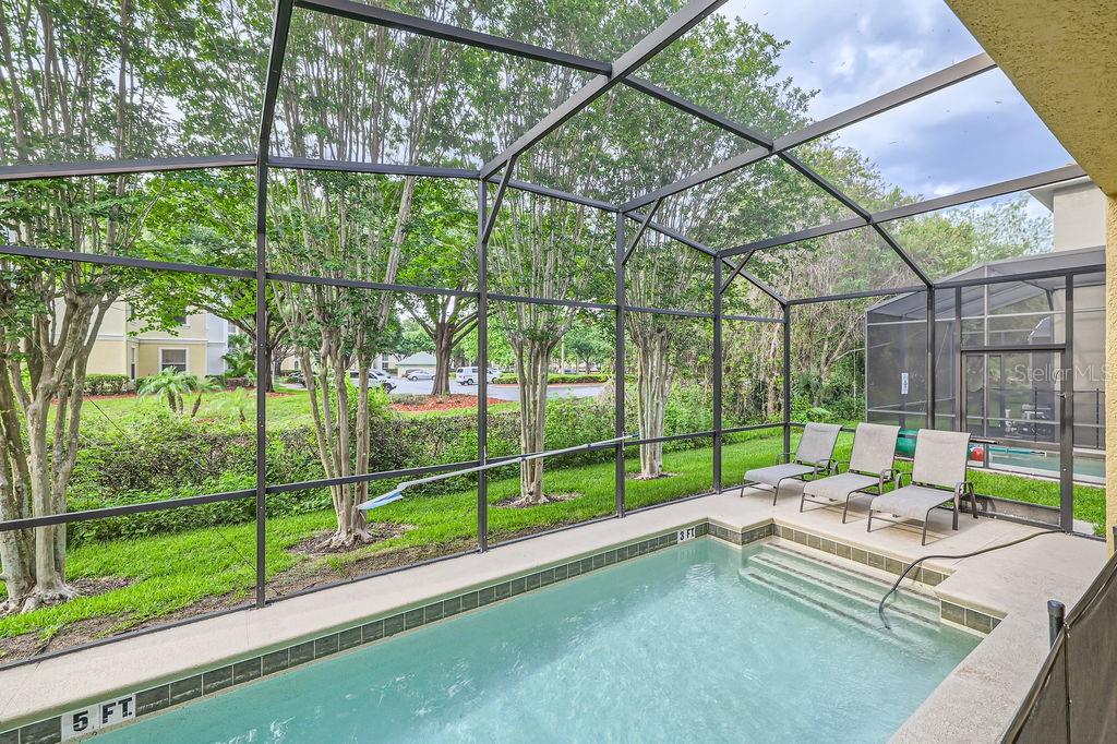 8989 Cuban Palm Road Kissimmee, FL 34747 - Photo 32 of 49 a garden view with a sitting space