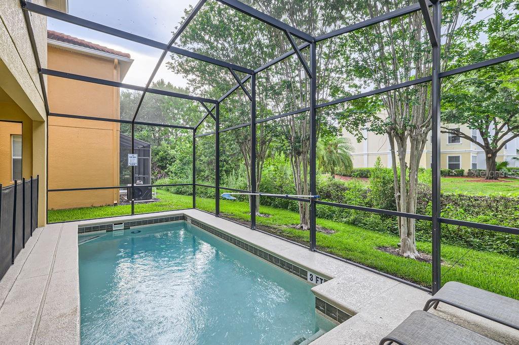 8989 Cuban Palm Road Kissimmee, FL 34747 - Photo 33 of 49 a view of swimming pool with a back yard