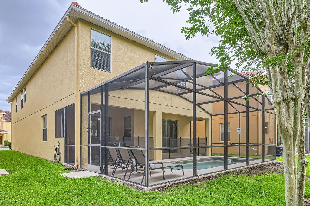 8989 Cuban Palm Road Kissimmee, FL 34747 - Photo 35 of 49 a view of a house with backyard and porch