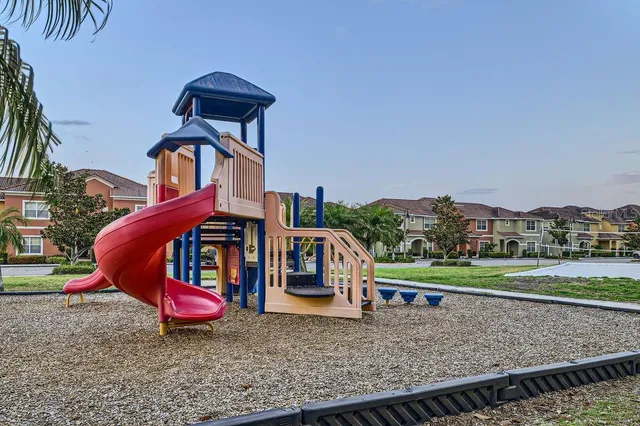 an outdoor space with furniture and garden