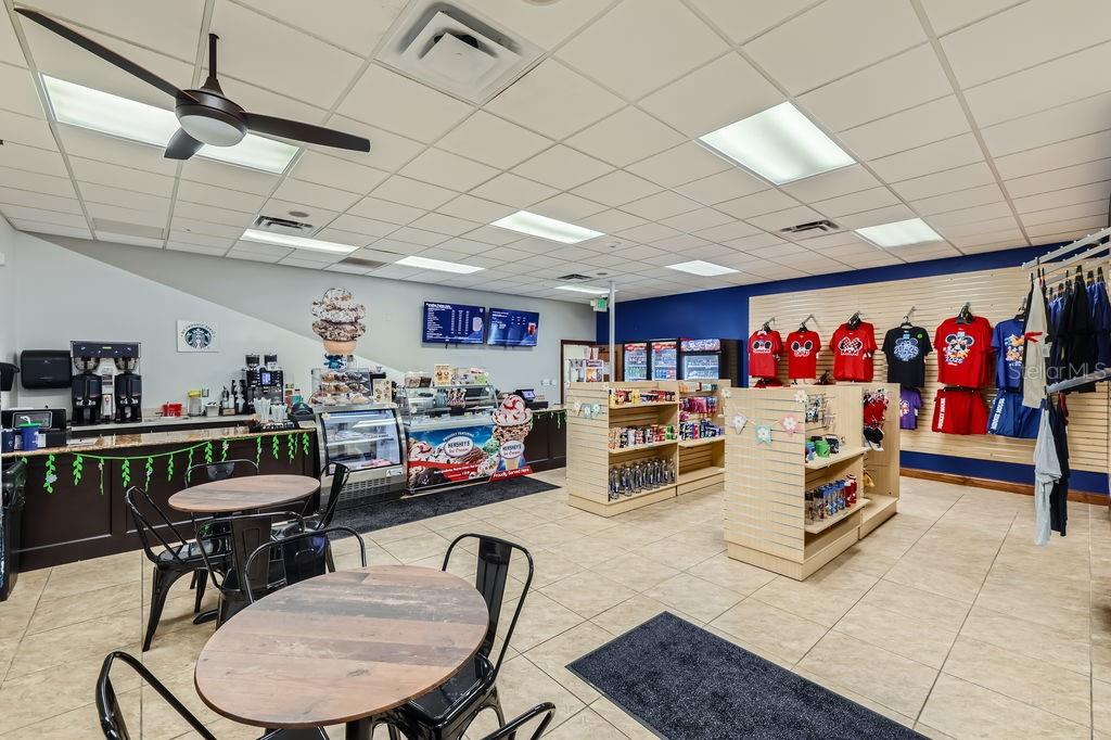 8989 Cuban Palm Road Kissimmee, FL 34747 - Photo 46 of 49 a living room with furniture and a flat screen tv