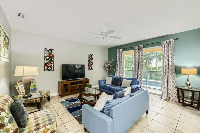 a living room with furniture and a flat screen tv