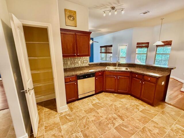 222 Raptor Drive Crestview, FL 32536 - Photo 14 of 42 a kitchen with stainless steel appliances granite countertop a sink stove and cabinets