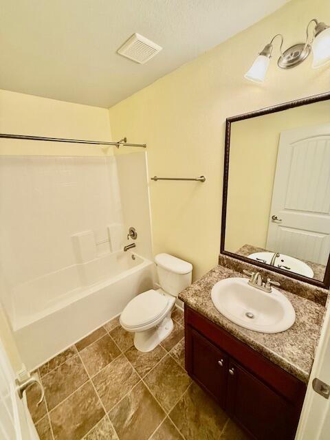 222 Raptor Drive Crestview, FL 32536 - Photo 30 of 42 a bathroom with a granite countertop sink toilet and shower