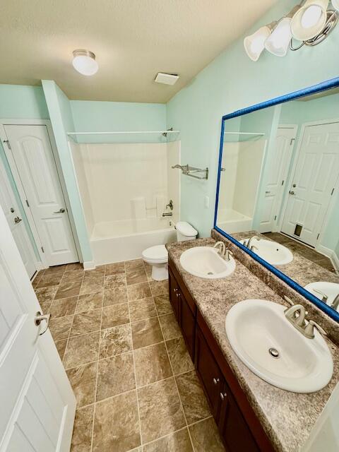 222 Raptor Drive Crestview, FL 32536 - Photo 33 of 42 a bathroom with a granite countertop sink and a mirror