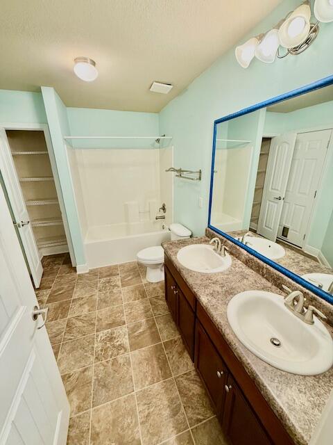 222 Raptor Drive Crestview, FL 32536 - Photo 34 of 42 a bathroom with a granite countertop sink a mirror and a bathtub