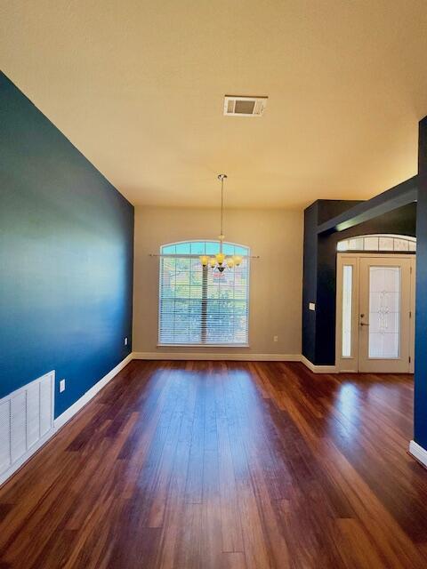 222 Raptor Drive Crestview, FL 32536 - Photo 6 of 42 a view of an empty room with window and wooden floor