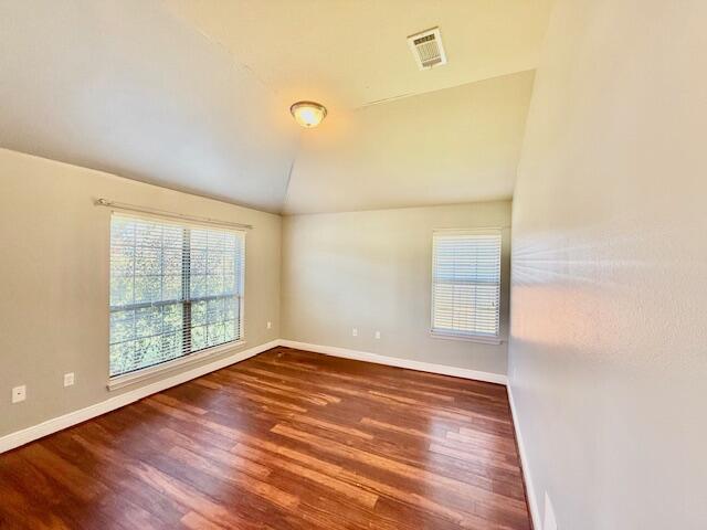 222 Raptor Drive Crestview, FL 32536 - Photo 7 of 42 a view of an empty room with wooden floor and a window